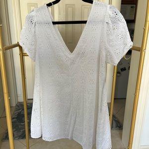 Urban outfitters mini white dress. Small stain on front. Embroidered fabric